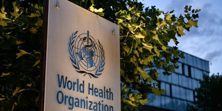 A photo taken in the late hours of August 17, 2020 shows a sign of the World Health Organization (WHO) at their headquarters in Geneva amid the COVID-19 outbreak, caused by the novel coronavirus. (Photo by Fabrice COFFRINI / AFP) (Photo by FABRICE COFFRINI/AFP via Getty Images)